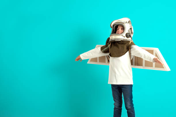 istock Young guy fancies himself donning BY PLANE PILOT HELMET 1143051444