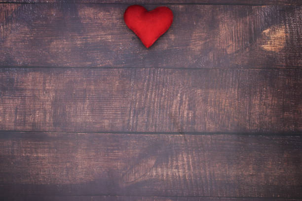 istock Red heart on the wooden table 1143054621