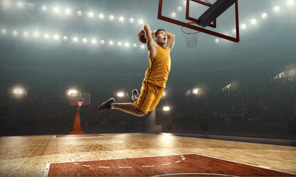 istock Basketball player makes jump shot. Slam Dunk 1143056381