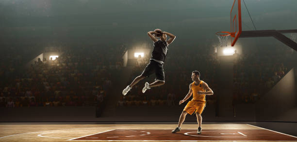 two professional basketball players fight fo a ball - basketball playing ball african descent imagens e fotografias de stock