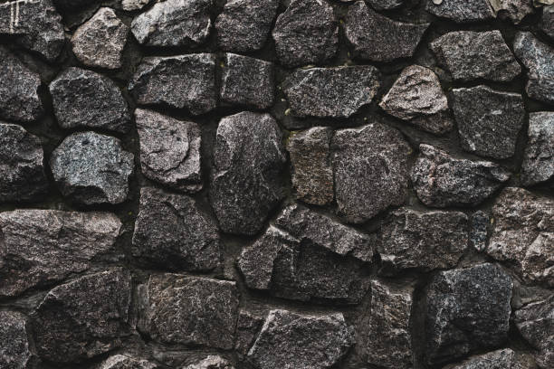 istock Stone wall background. Wall cement background. Old cement texture. Concrete surface. Black dark background. Brick wall background. Abstract wallpaper. Gray concrete texture. Black stone background. 1143057770