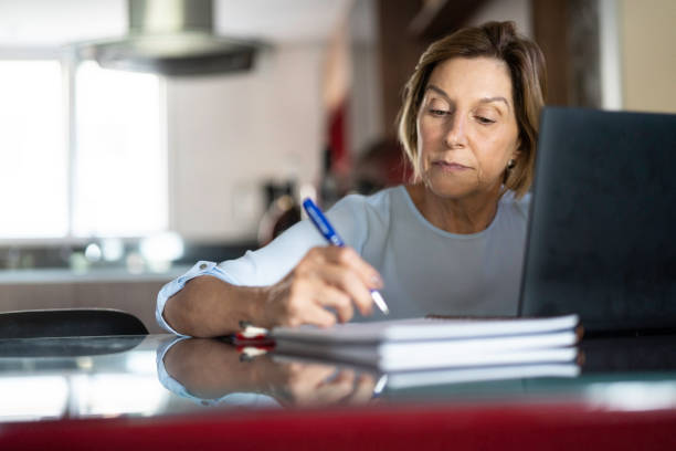 Mature woman working at home