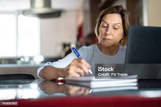 Mature Woman Working At Home Stock Photo - Download Image Now - Learning, Senior Adult, Studying