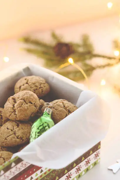 Danish Peppernuts (Pebernodder). Traditional Christmas danish cookies in a gift box. Cozy winter and Christmas setting, warm and homely. Danish hygge concept