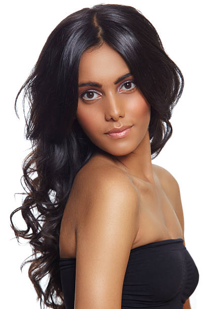 Portrait of a woman with long curly black hair stock photo