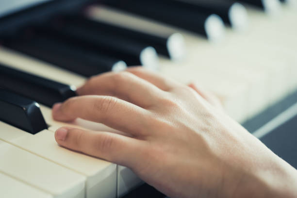 istock Child Hand playing Music keyboard electric piano 1143058921
