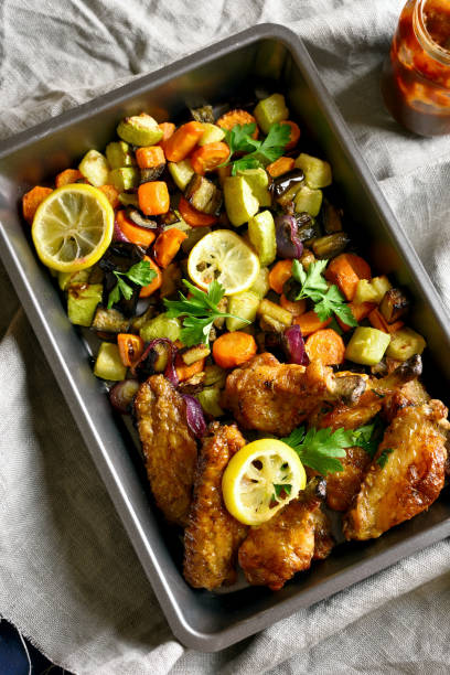 istock Grilled vegetables and chicken wings 1143059912