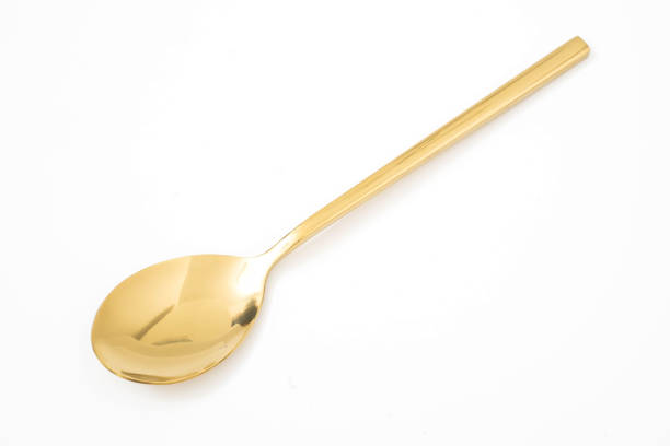 istock golden spoon isolated on a white background 1143062335