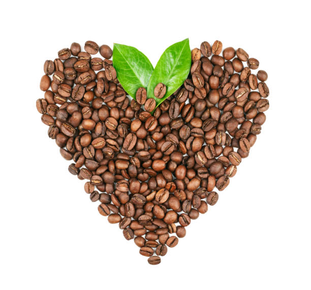 istock Coffee beans heart shaped with leaves isolated on white background 1143063421