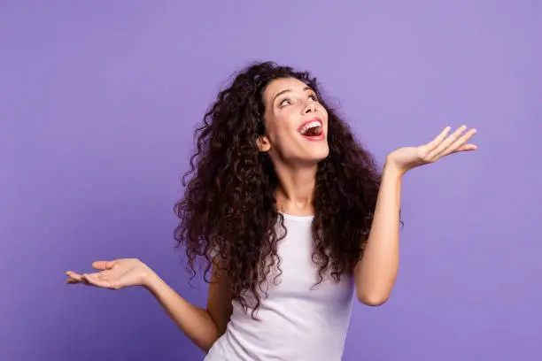 Photo of Close up photo beautiful amazing her she lady scream yell shout look up empty space both arms show products higher lower wear casual white t-shirt clothes outfit isolated violet purple background