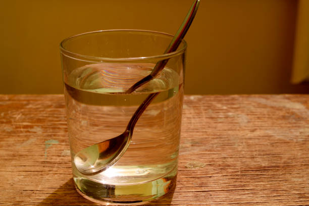 istock A glass of water and a spoon 1143064209