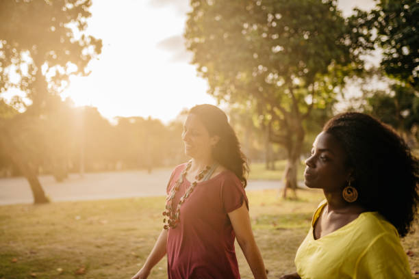 istock two brazilian woman walking outdoors at sunset 1143066992