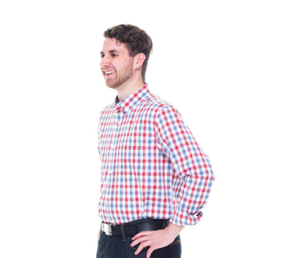 istock Attractive young man wearing a checked shirt and jeans - hands on hips 1143068825