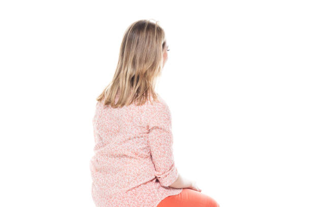istock Good looking white female standing on white background - sitting 1143068953