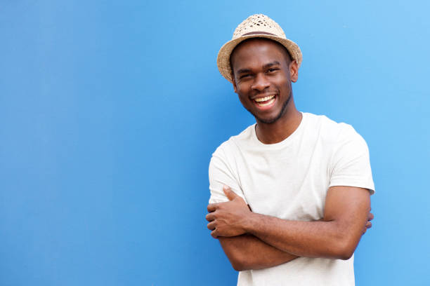 Portrait of african american man smiling against blue background