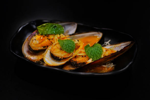 istock Japanese food: Grilled seafood on table. Clean food concept. Toned image. Selective focus and free space for text. 1143073930