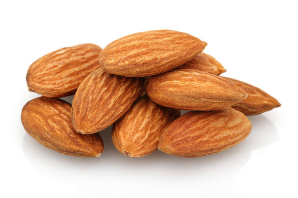 istock Heap of almonds isolated on white 1143076760