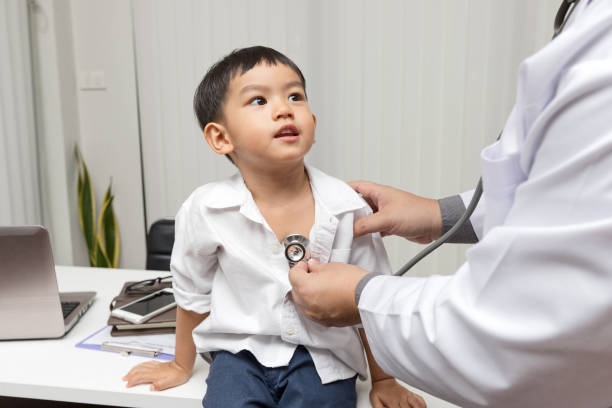 istock Pediatrician is diagnosing little patient using a stethoscope 1143077067
