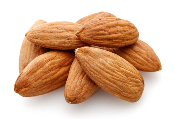 istock Heap of almonds isolated on white 1143077151