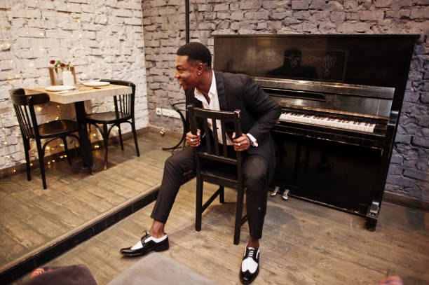 istock Strong powerful african american man in black suit 1143078314