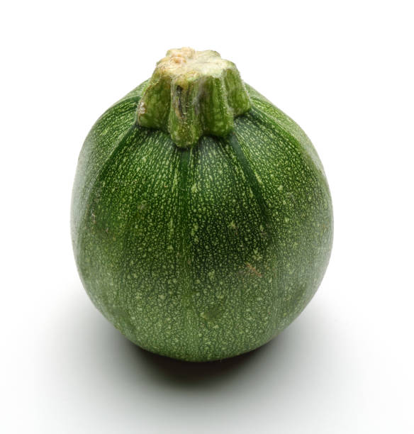 istock Green round zucchini isolated on white 1143079761