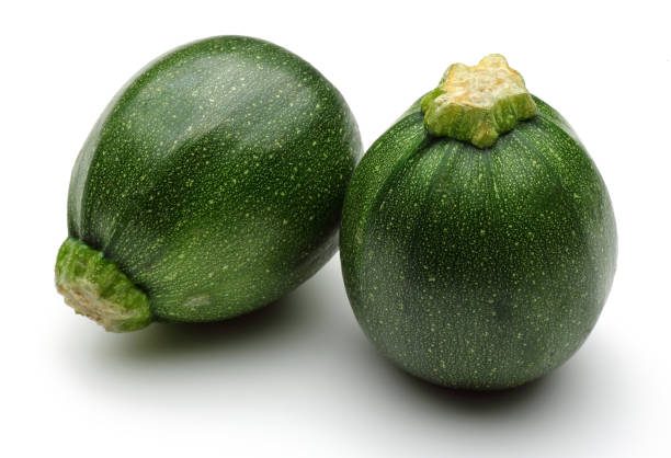 istock Green round zucchini isolated on white 1143079795