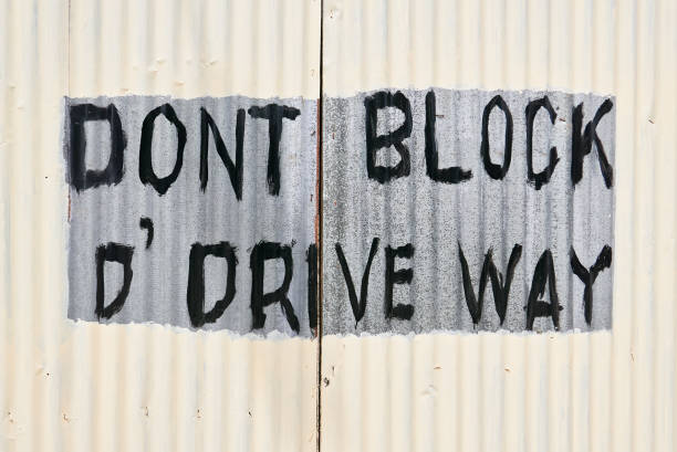 istock Newly painted gate with writing 'Don't block the driveway' 1143079836