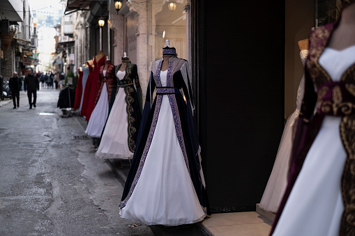 Izmir, Turkey - April, 2019: View from historical Kemeralti bazaar. The bazaar formed originally around a long street. Starts at Konak Square beside the government office. People walking in the streets of Kemeralti.