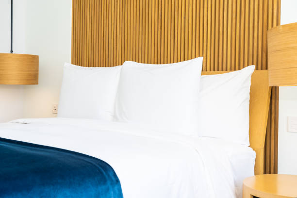 istock Beautiful comfortable pillow on bed decoration in bedroom 1143081715