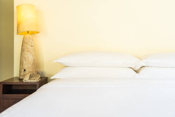 istock Beautiful comfortable pillow on bed decoration in bedroom 1143082784