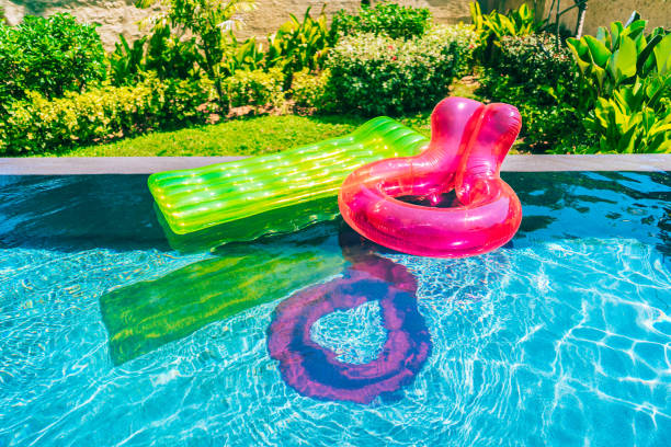 istock Colorful swim ring or rubber float around swimming pool water 1143082974
