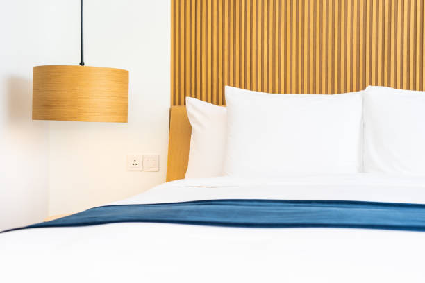 istock Beautiful comfortable pillow on bed decoration in bedroom 1143083076