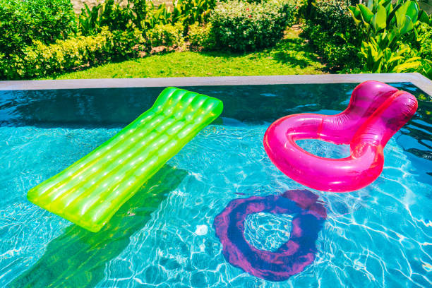 istock Colorful swim ring or rubber float around swimming pool water 1143083213