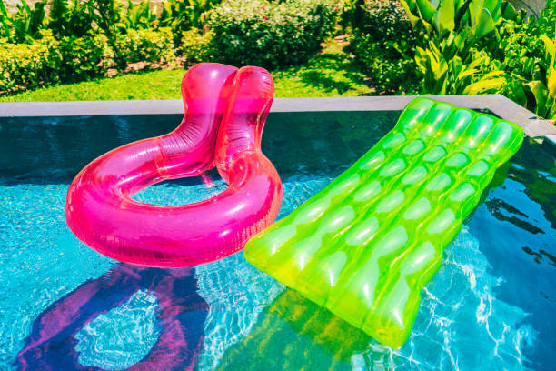 istock Colorful swim ring or rubber float around swimming pool water 1143083253