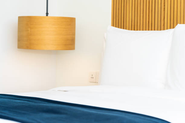 istock Beautiful comfortable pillow on bed decoration in bedroom 1143084223