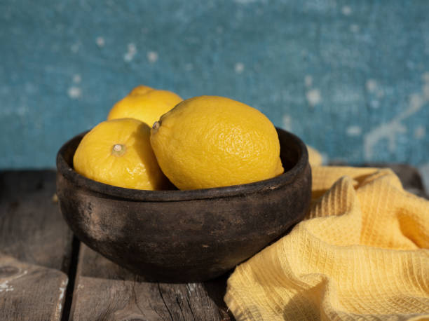 lemons in a bowl in the open air