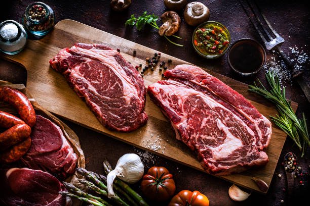 istock Top view of two raw beef steaks on cutting board 1143086127