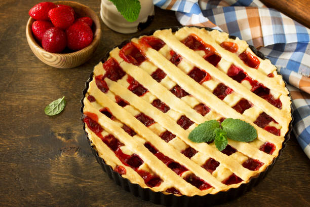 istock Berry pie summer. Sweet pie, tart with fresh berry strawberries on a rustic kitchen table. Delicious cake with strawberries. Copy space. 1143086810