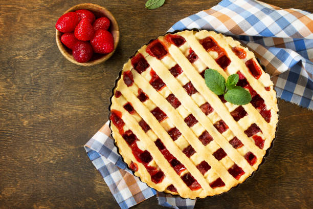 istock Berry pie summer. Sweet pie, tart with fresh berry strawberries on a rustic kitchen table. Delicious cake with strawberries. Top view flat lay background. Copy space. 1143086820