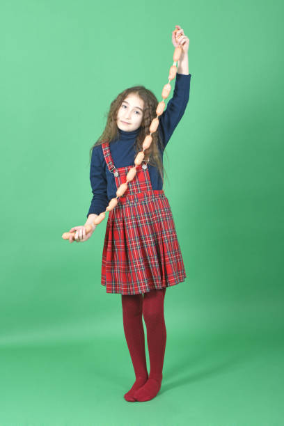 istock Young girl holds sausages 1143086872