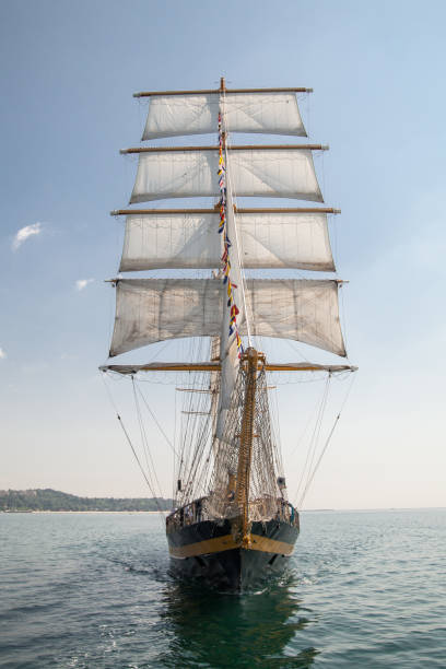 istock old historical ship (yacht) with white sails, sailing in the sea 1143089122