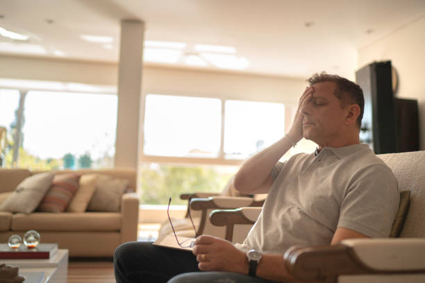 istock Worried and tired man doing home office 1143090191