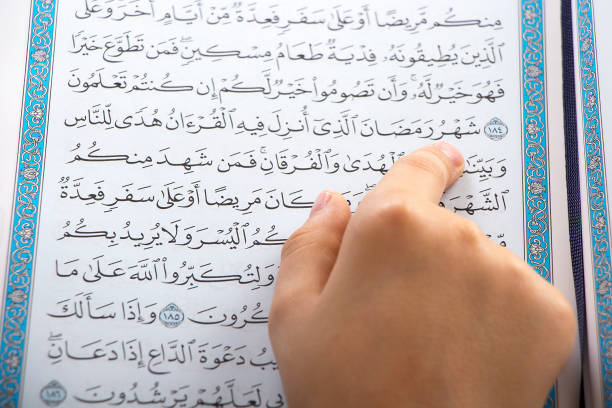 istock Muslim boy reading the Quraan in Ramadan 1143090219
