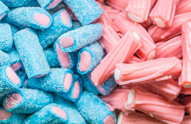 Background of multi-colored assorted jelly beans, chewing candies close-up.