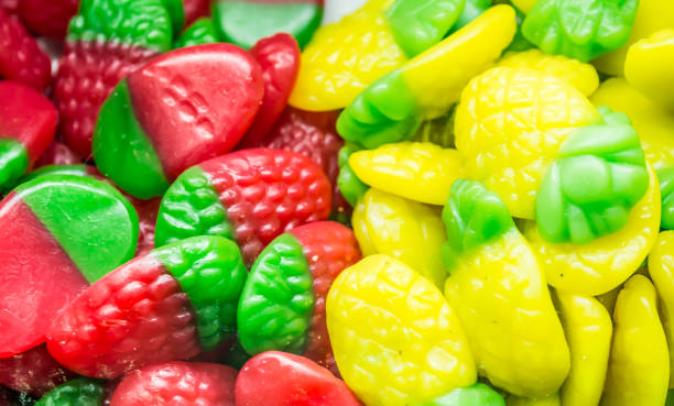 istock Background of multi-colored assorted jelly beans, chewing candies close-up. 1143090398