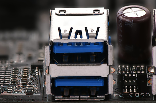 Motherboard closeup with microchips and electronic elements.