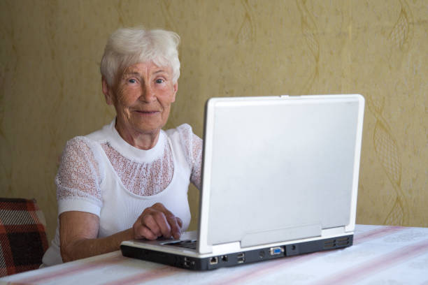 istock An elderly woman and a laptop. 1143093293