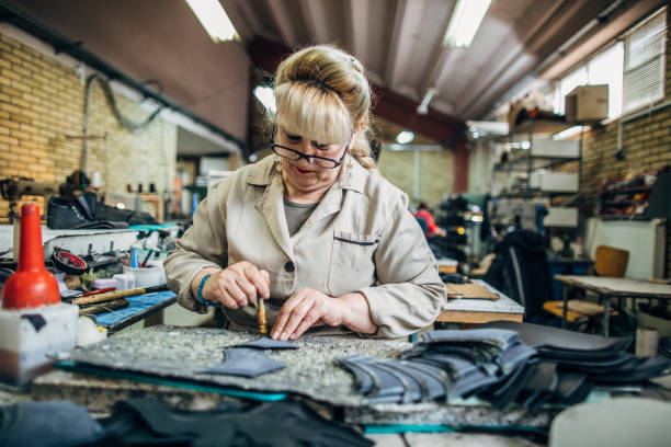 istock Woman making shoe 1143093650