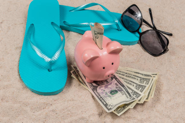 istock Beach Vacation Savings Theme With Piggy Bank 1143096347