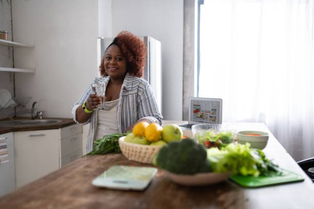 istock Positive delighted curly haired housewife looking at camera 1143096838